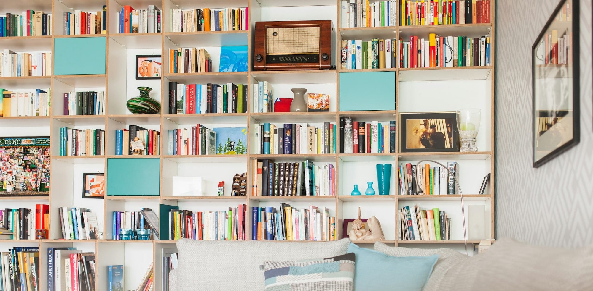 white wooden book shelf with books